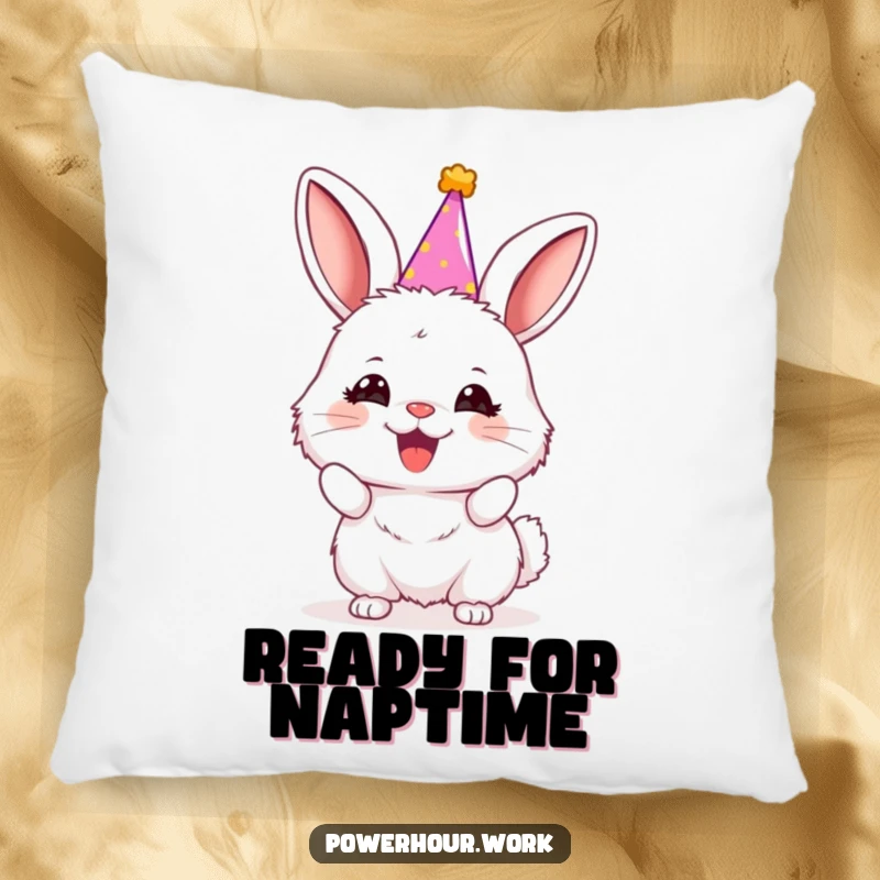 Funny bunny in a small party hat, enthusiastically cheering, on a soft and decorative pillow.