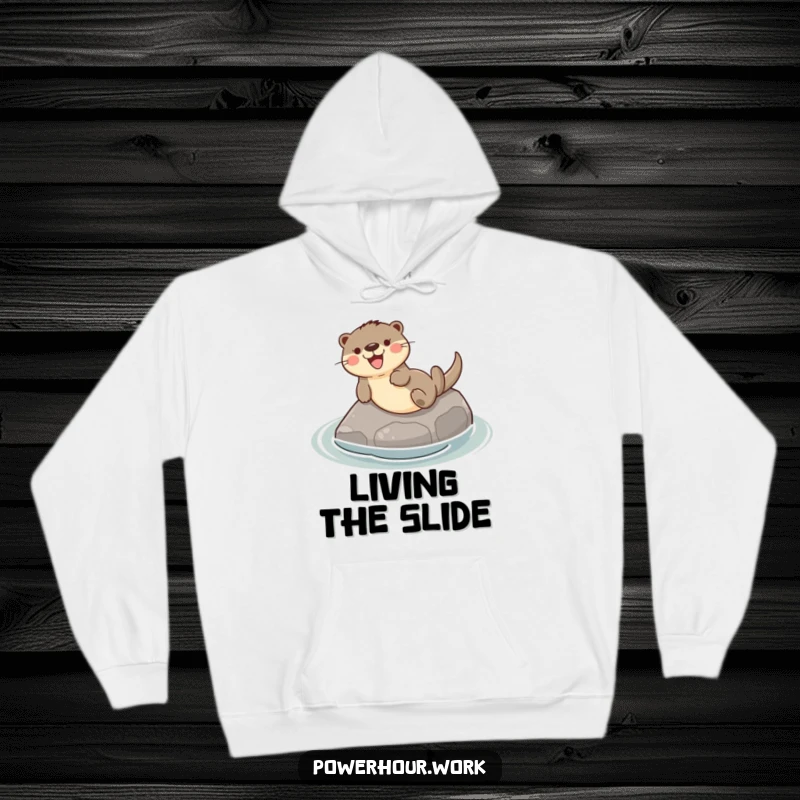 Funny hoodie featuring a playful otter gleefully sliding down a smooth river stone, embodying relaxed fun.