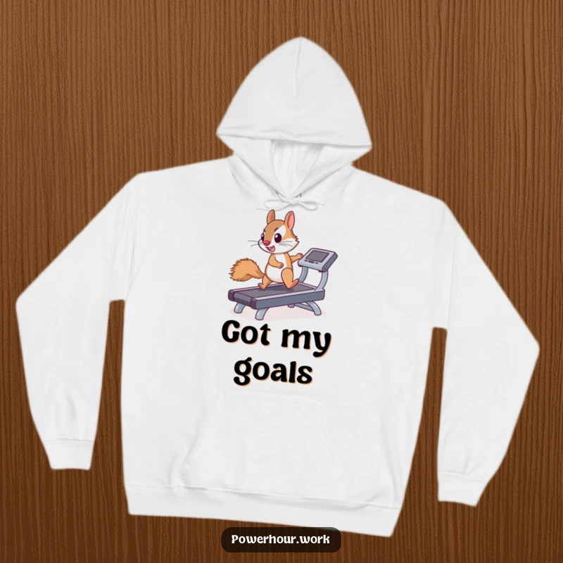 Funny hoodie showing a determined squirrel enthusiastically running on a miniature treadmill, a symbol of unwavering effort.